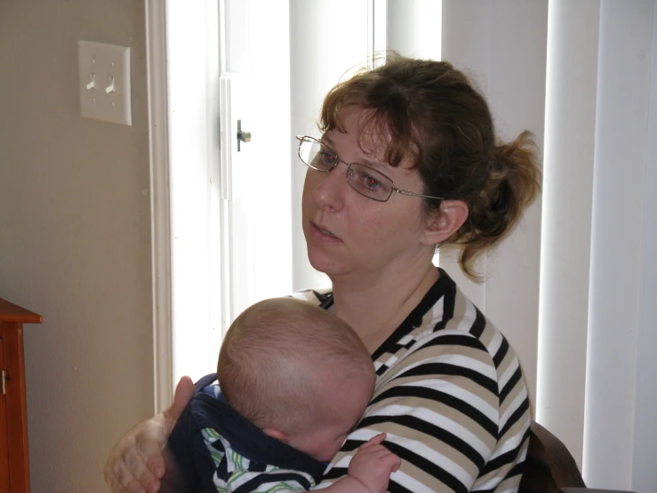 an image of a woman holding a child