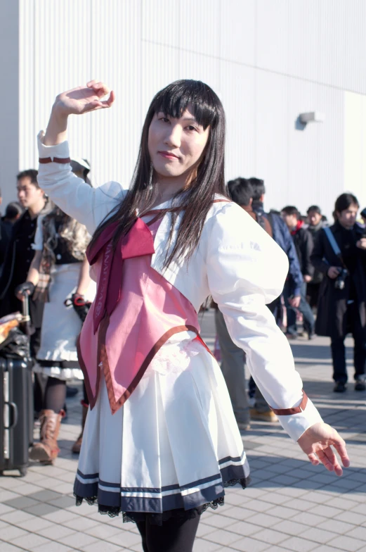 a person in a dress with long hair and black stockings