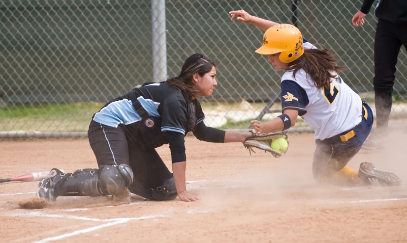 a catcher attempting to tag another player out during a baseball game