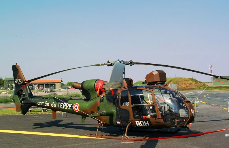 a military style helicopter on display at an airshow