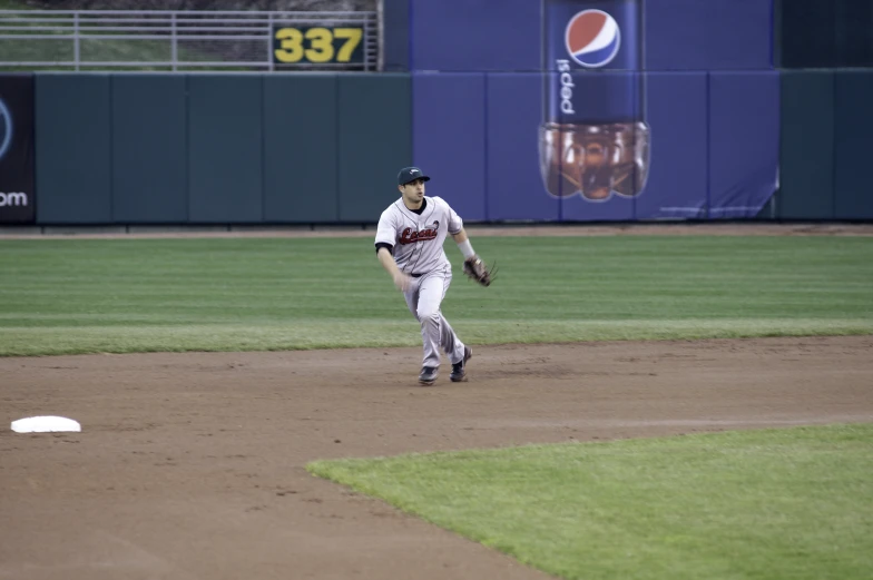 a baseball player is running on the field