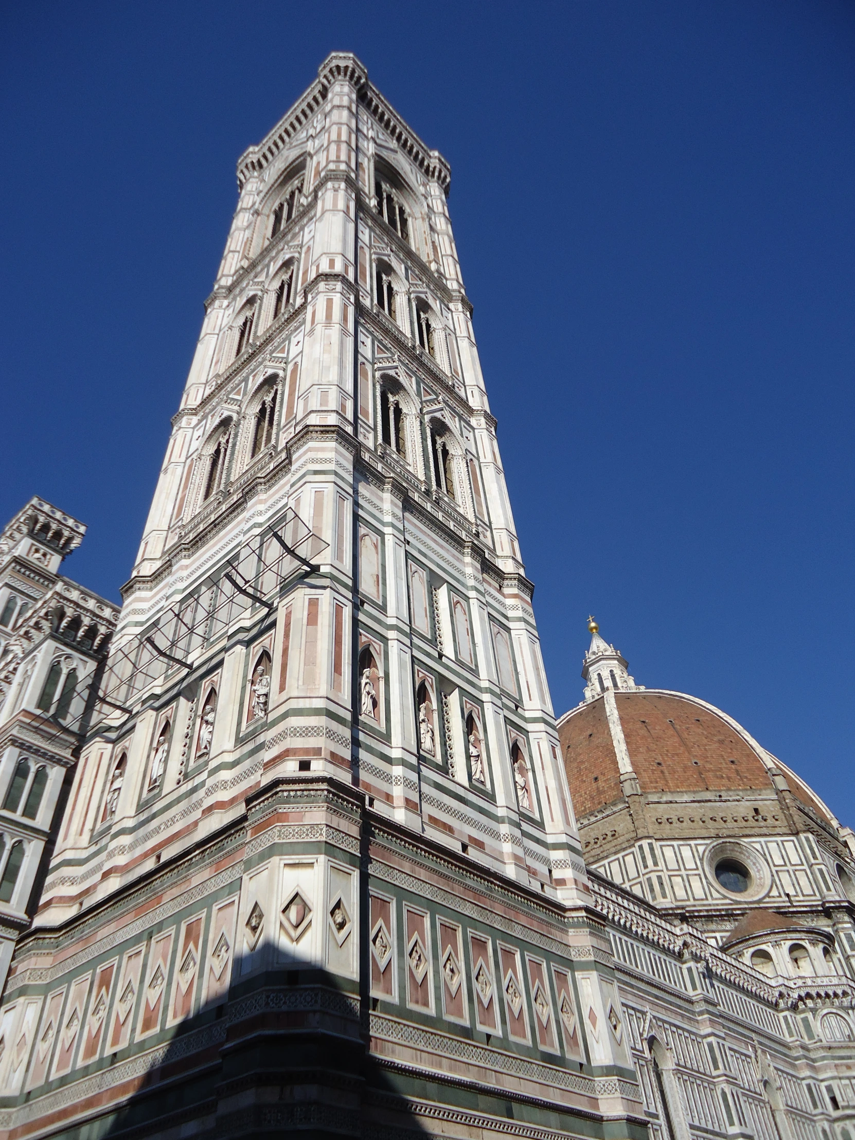 a tall building with many steeples and windows