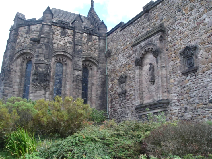 there is a castle that has stone walls and windows