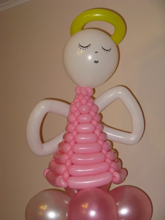 a tall statue made of balloons on the top