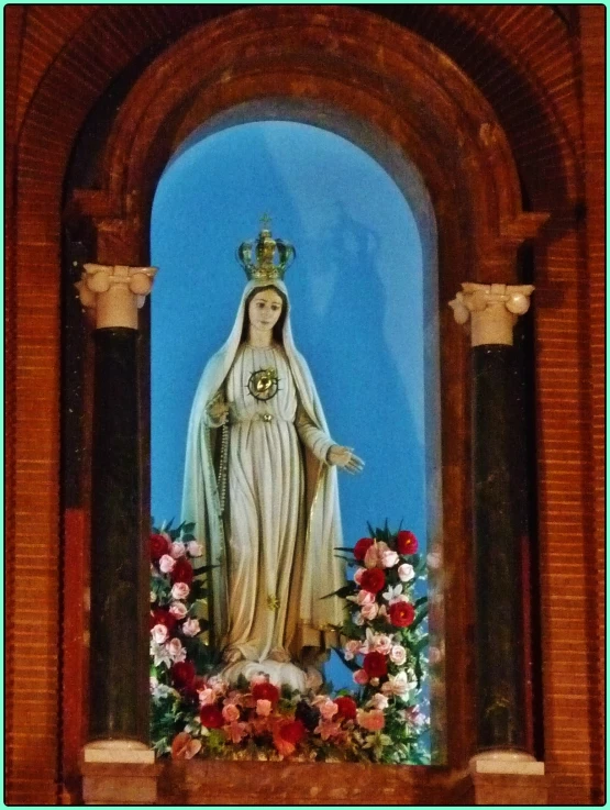 a close - up image of the statue of mary