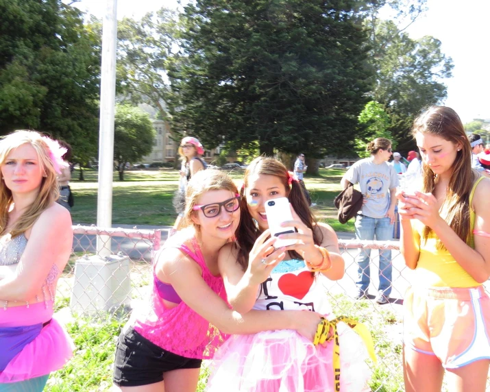 two girls are standing up and taking a po