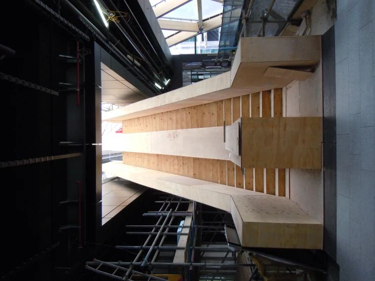 a building with a wooden wall and metal stairs