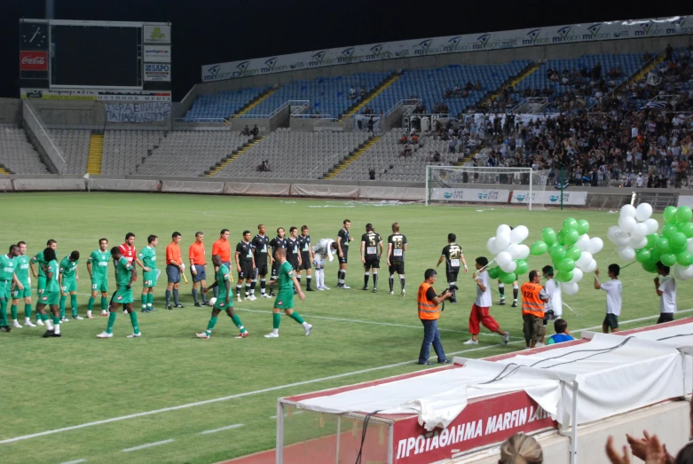 a soccer team standing on a soccer field