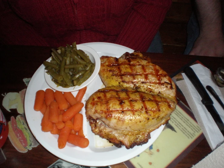 a plate filled with meat and veggies