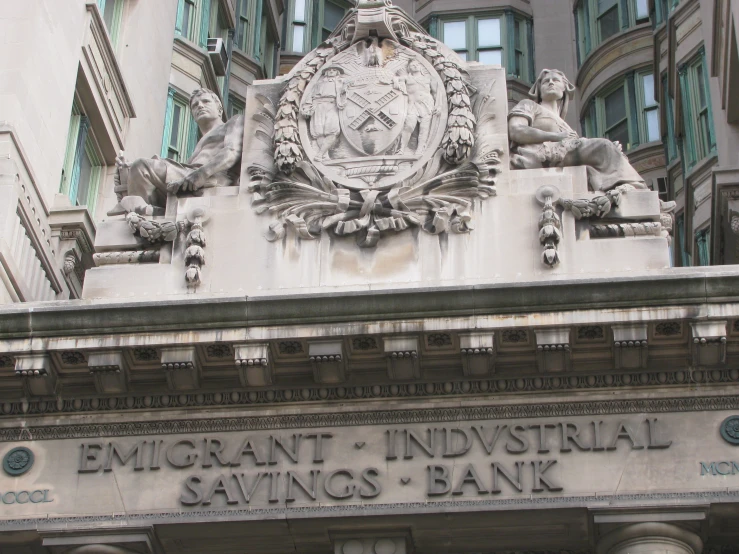 a large building with a sign for the bank