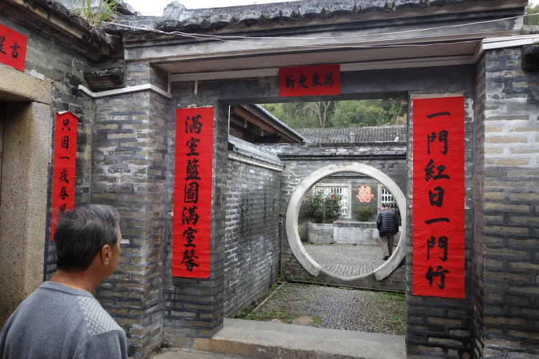 the man is standing in front of a building