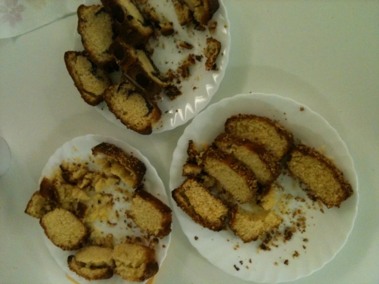 three white plates of food, one with cinnamon bread on it and the other topped with vanilla