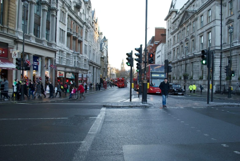 the traffic signal is green on a busy street