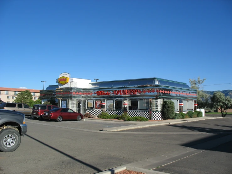 a large, round, empty building next to a street