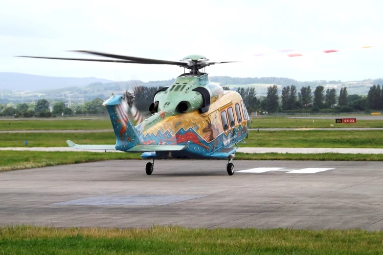 a very nice looking helicopter on the runway