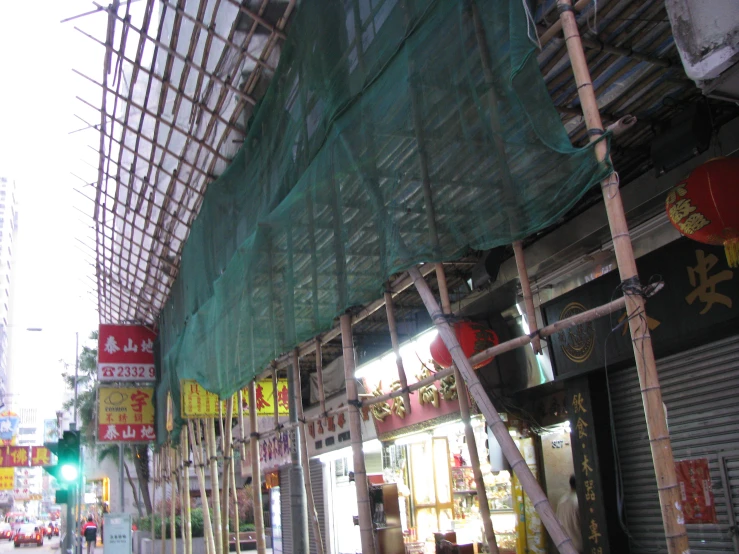 a po of asian signs lining the outside of an oriental restaurant