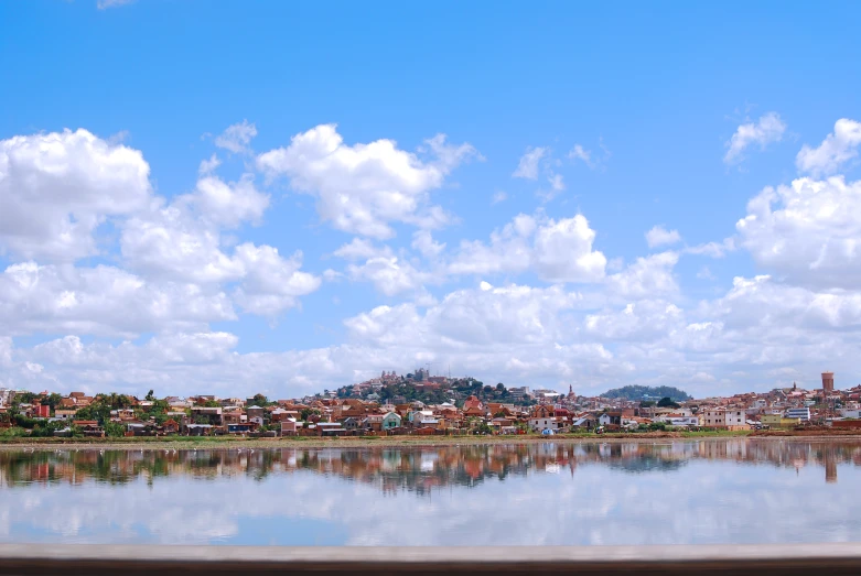 city with buildings and water at day time