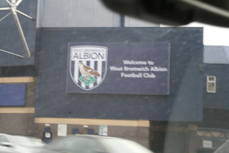 a sign outside the aylon west rememnce stadium
