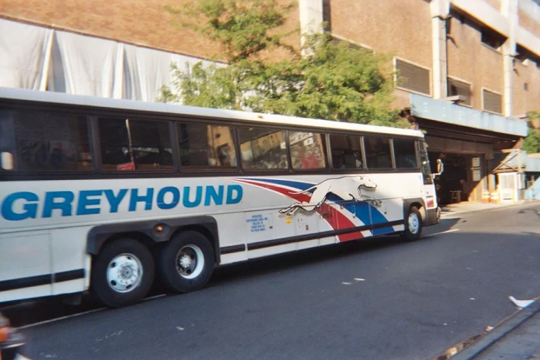 a bus stops at a bus stop on a quiet street