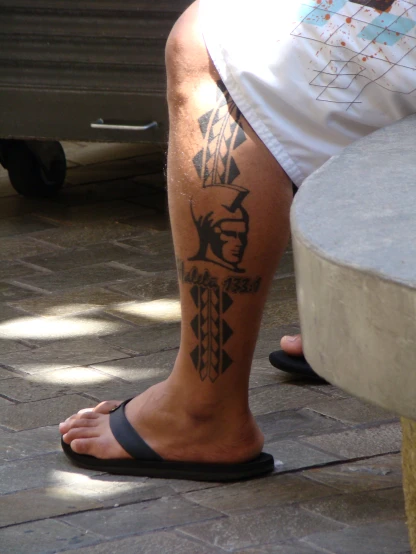 a person with some tattoos on their legs