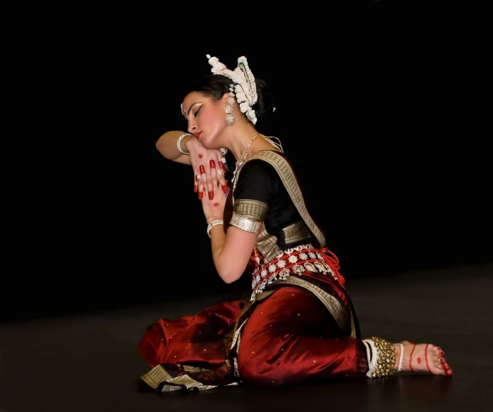 a young woman is dressed in traditional garb