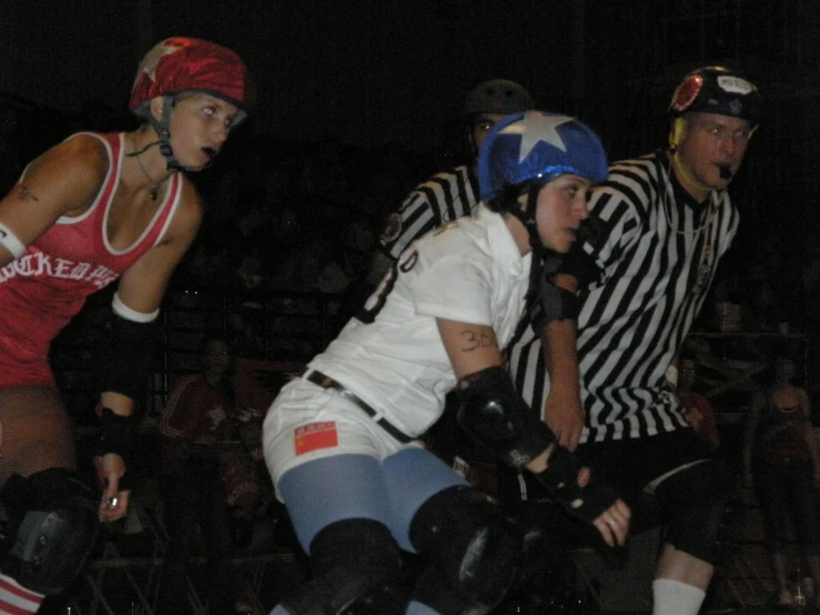 a group of people on roller skates at a event