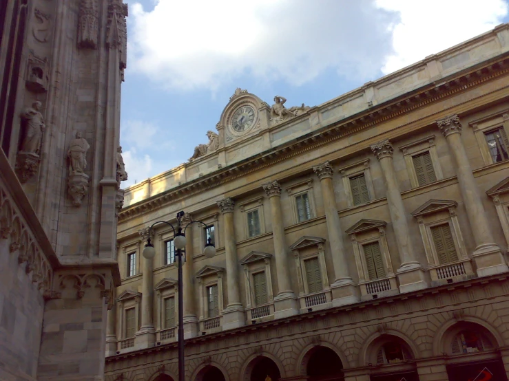 the old buildings have clocks mounted on them