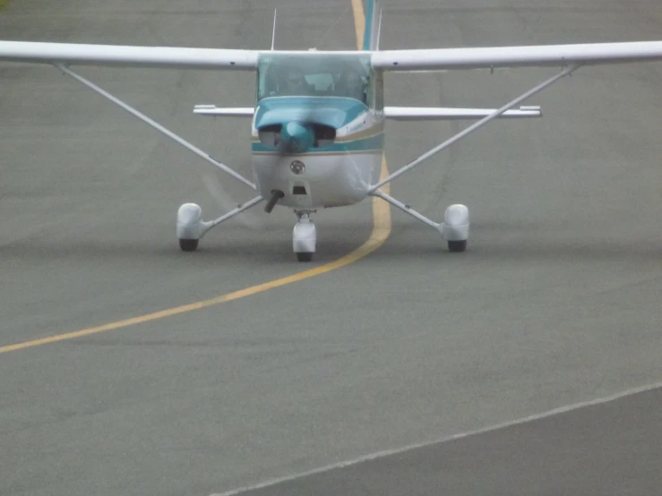 a small plane is parked on a runway