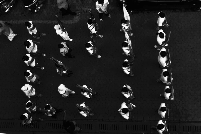 black and white po of an overhead street with several pedestrians