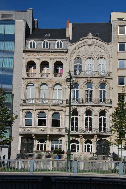 a large building with many windows and railings