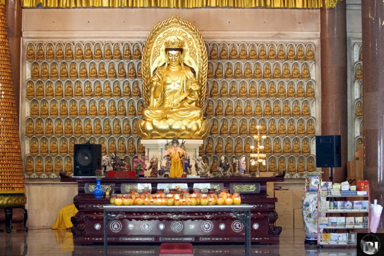 the inside of a store with a buddha statue