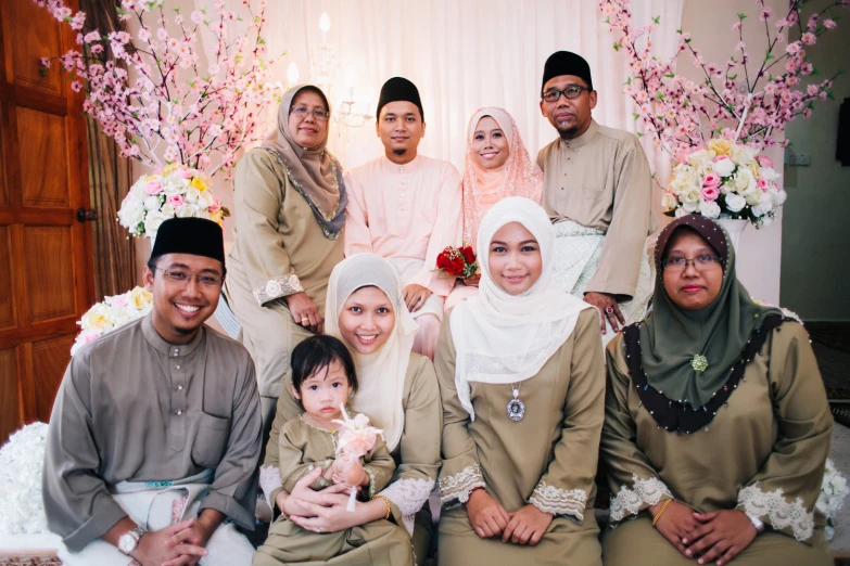 a family po in front of a decorated stage