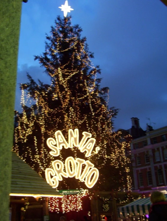 a christmas tree in front of the famous santa cruz neighborhood