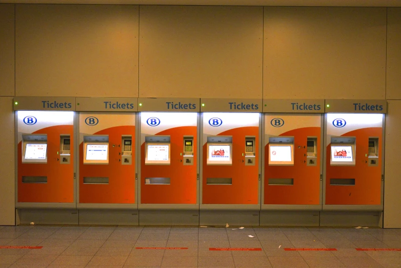 this is a machine in an airport next to a wall