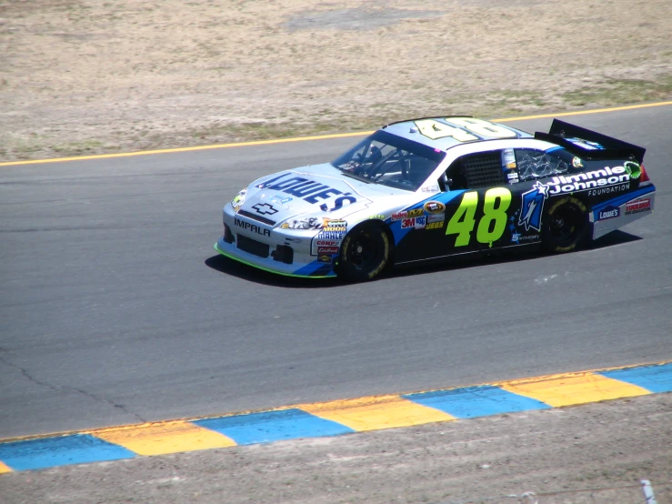 a man racing on a car during a race