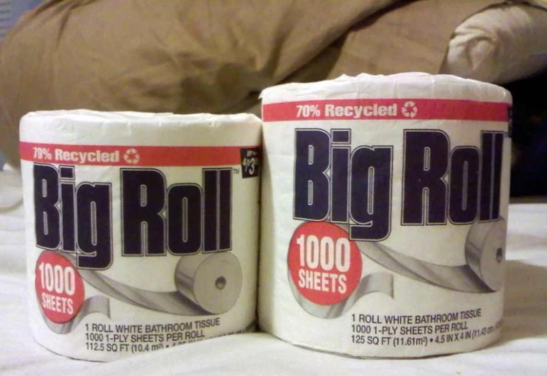 two rolls of toilet paper sitting on top of each other