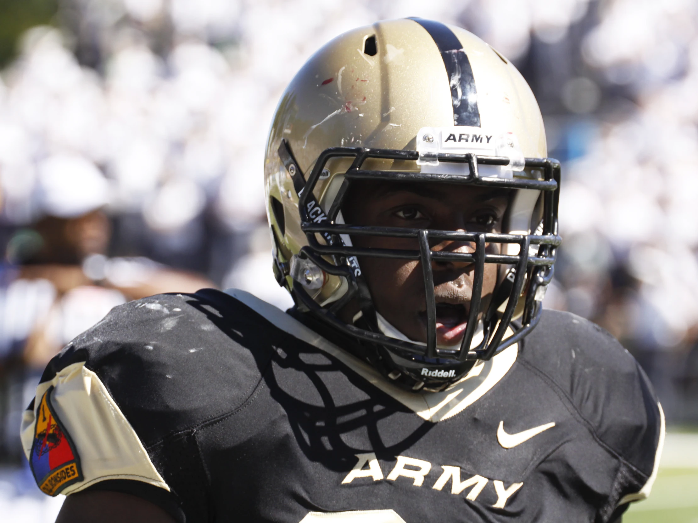 a close up of a football player with a helmet