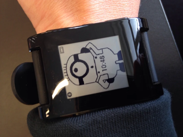 a watch with a drawing of a cartoon character on it