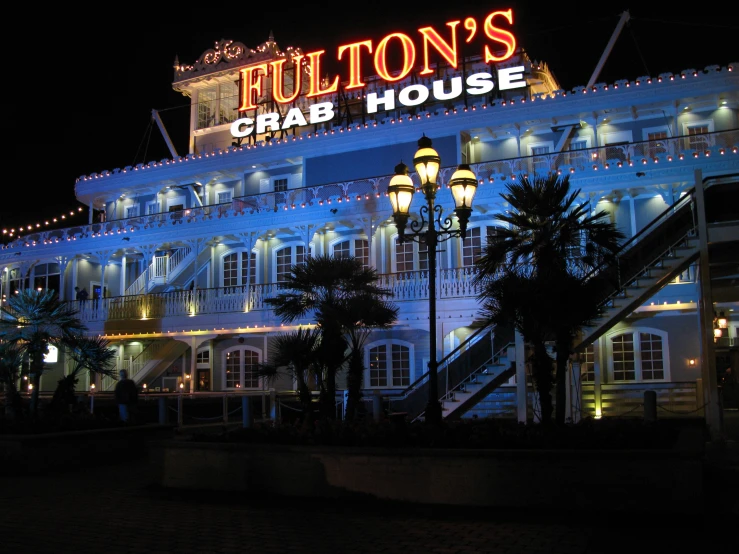 the fulldon's crab house sign lit up at night