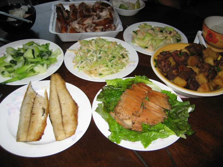 a close up of plates with food on a table