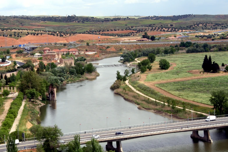 an overhead view of a town and a river