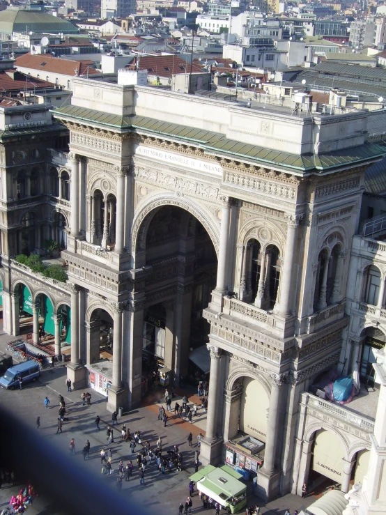 the building has a bunch of arches and a tower