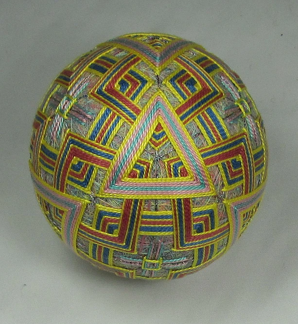 an intricateally patterned ball is on display