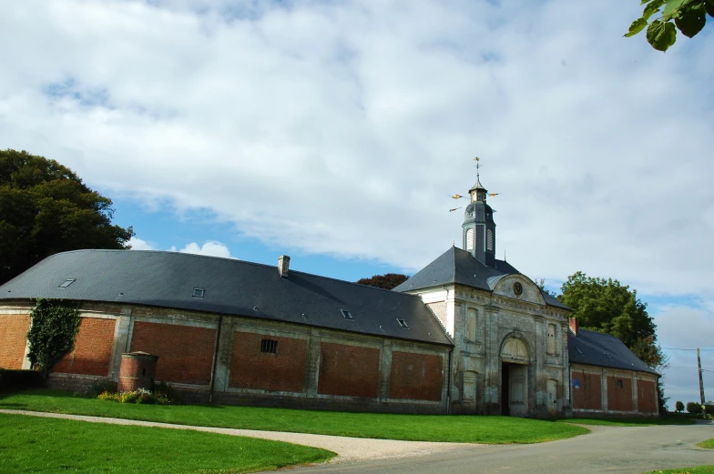 a large church with a very tall tower in the center