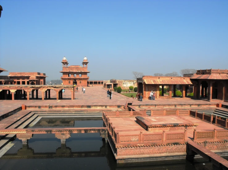 many small buildings are standing next to the water