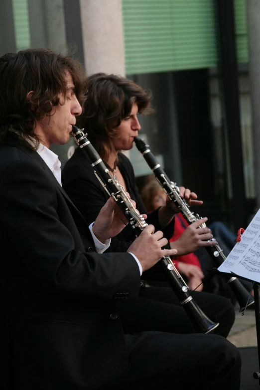 a band plays on a city street near a building
