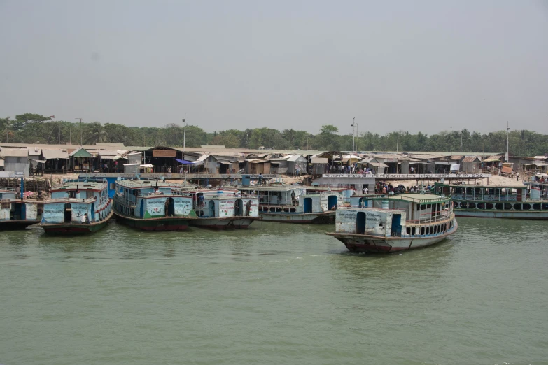 a bunch of small boats are out in the water