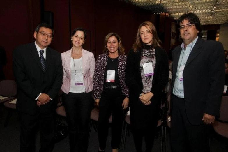 group of people dressed in business attire at event