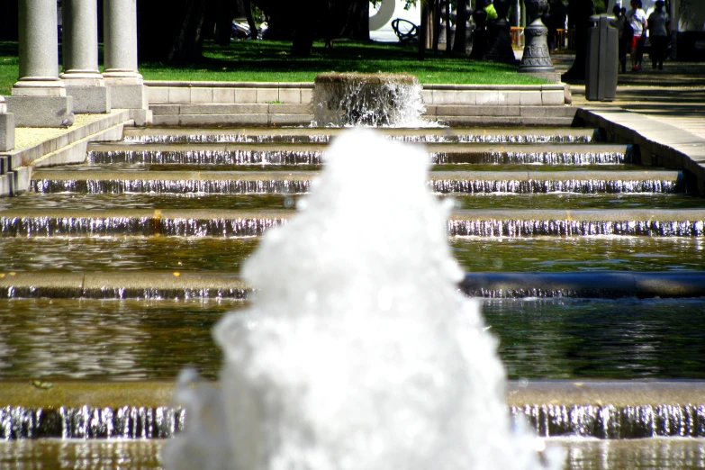 the small fountain has water flowing in it