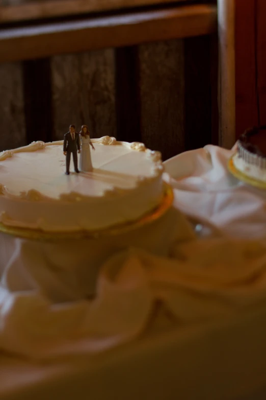 a small wedding cake that is sitting on the table